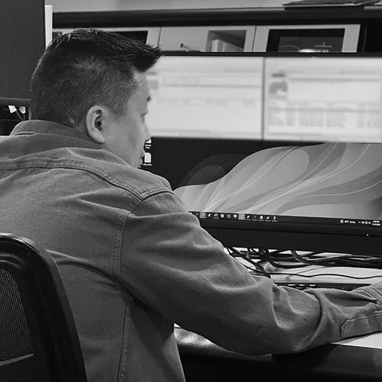 A Wescom Resources employee is hard at work at his workstation